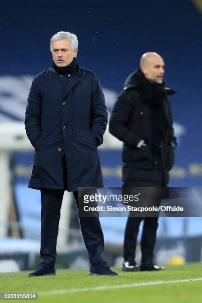 Tottenham Hotspur manager Jose Mourinho and Manchester City manager Pep Guardiola look on during the Premier League match between Manchester City and...