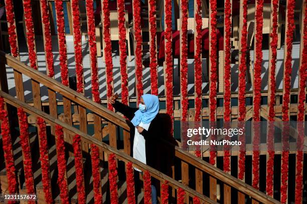 Palestinian girl takes selfie inside a coffee shop next to a beach on Valentine's day in Gaza City on February 14, 2021. Valentine's Day is...