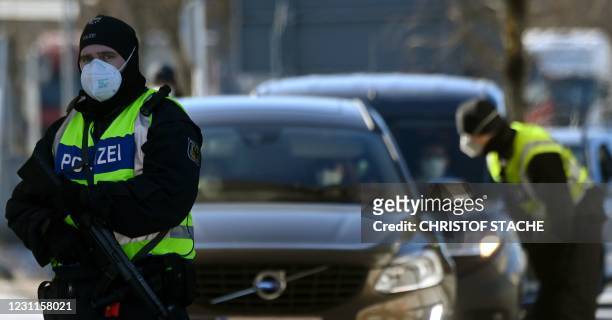 Officers of the Federal Police control car drivers at the border crossing between Austria and Germany, near the southern German village of...