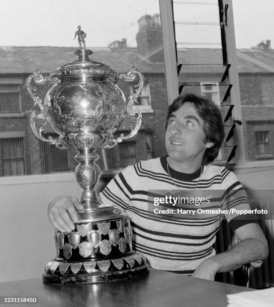 Liverpool reserve team manager Roy Evans looking at the Central League Championship trophy at Anfield in Liverpool, England, circa January 1977.