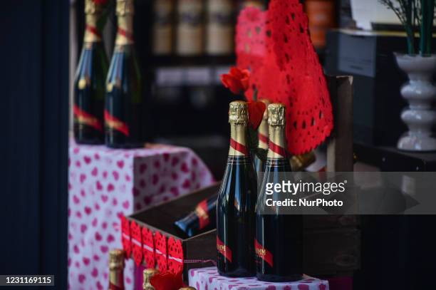 Bottles of Mumm Cordon Rouge Champagne and a red heart-shaped serviettes seen in a Off Licence window in Ranelagh, Dublin, during Level 5 Covid-19...