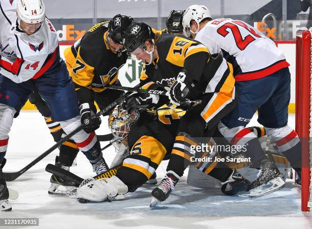 Tristan Jarry of the Pittsburgh Penguins makes a save against the Washington Capitals at PPG PAINTS Arena on February 14, 2021 in Pittsburgh,...