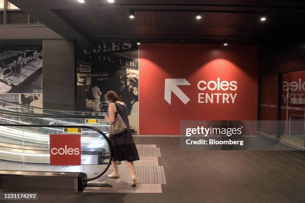 Customer uses an escalator from the underground car park at the Coles Group Ltd. Supermarket in the Elsternwick suburb of Melbourne, Australia, on...