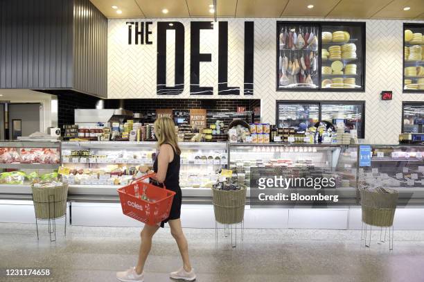 Customers walks past the deli section at the Coles Group Ltd. Supermarket in the Elsternwick suburb of Melbourne, Australia, on Thursday, Feb. 11,...