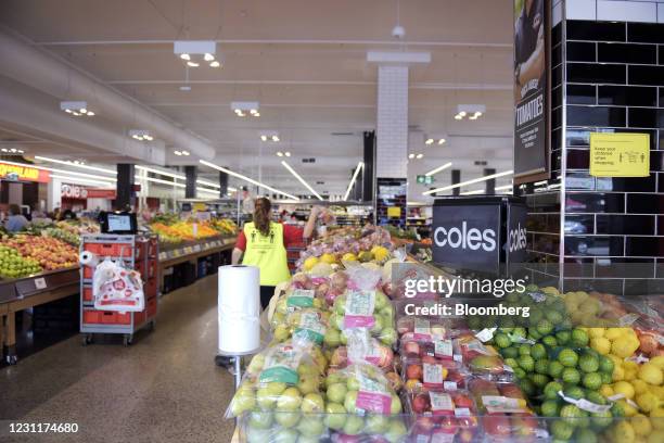 An employee picks up goods while processing an order for the Coles Group Ltd. Click&Collect online shopping service in the retailer's supermarket in...