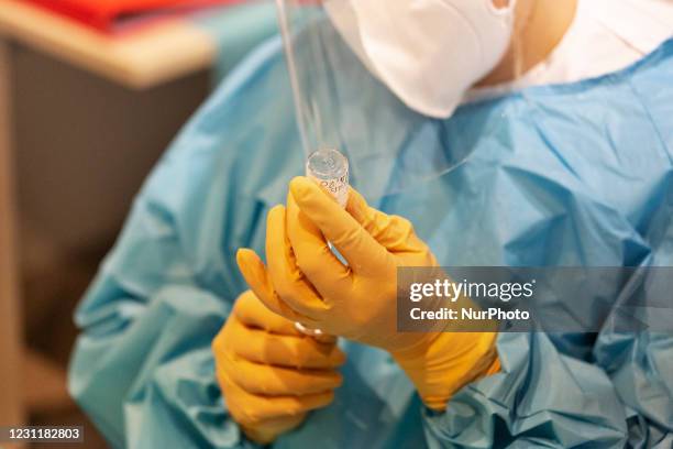 An healt worker prepare a syringe of Moderna vaccine during the first day of vaccination for the over-80s in Roma on 15th of February, Italy.