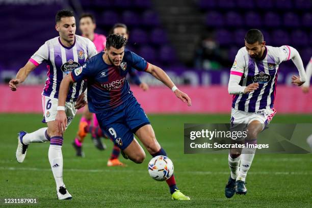 Bruno Gonzalez of Real Valladolid, Rafa Mir of SD Huesca, Joaquin Fernandez of Real Valladolid during the La Liga Santander match between Real...