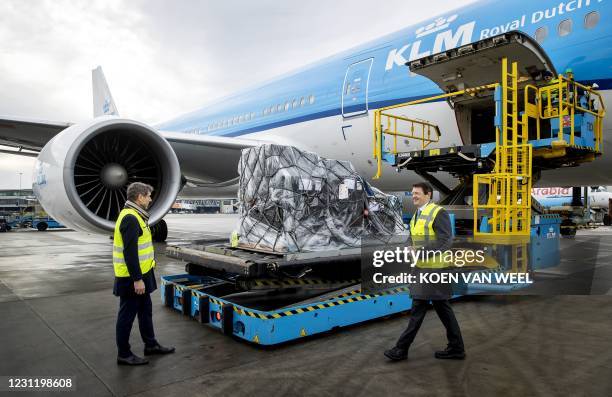 Resigning State Secretary Paul Blokhuis and KLM CEO Pieter Elbers check a KLM aircraft loaded with vaccines against the coronavirus Covid-19 on...