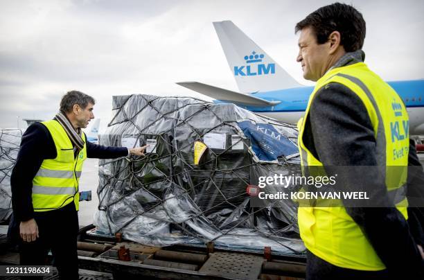 Resigning State Secretary Paul Blokhuis and KLM CEO Pieter Elbers check a KLM aircraft loaded with vaccines against the coronavirus Covid-19 on...