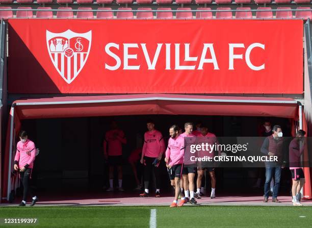 Sevilla's palyers arrive for a training session at the Ciudad Deportiva Jose Ramon Cisneros Palacios training ground in the outskirts of Seville on...