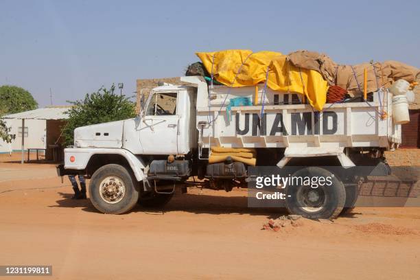 The United Nations-African Union peacekeeping mission in Sudans Darfur region hands over its sector headquarters to the Sudanese government in Khor...