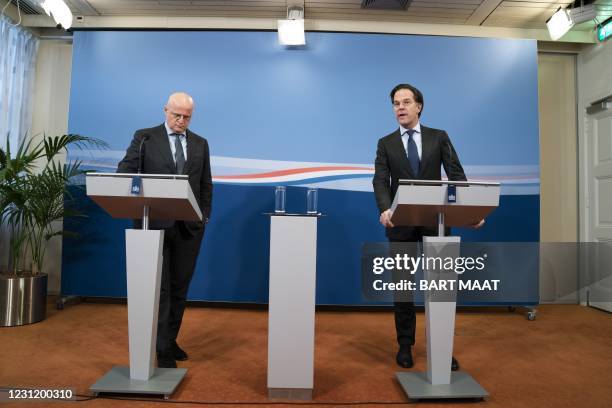 Outgoing Prime Minister Mark Rutte and outgoing Minister for Security and Justice Ferd Grapperhaus give a press conference in The Hague, on the...