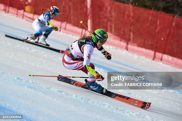 Austrian Katharina Liensberger and American Paula Moltzan compete in the first run of the round of 4 in the Women's Parallel Giant Slalom event on...