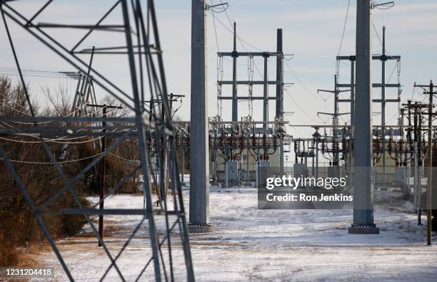 Transmission towers and power lines lead to a substation after a snow storm on February 16, 2021 in Fort Worth, Texas. Winter storm Uri has brought...