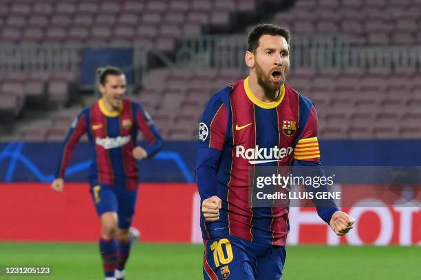 Barcelona's Argentinian forward Lionel Messi celebrates after scoring a goal during the UEFA Champions League round of 16 first leg football match...