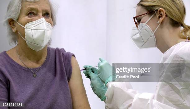 Renate Schulz, left, receives a 'Moderna COVID-19' vaccination by doctor Laura Tosberg, right, at a new coronavirus, COVID-19, vaccination center at...