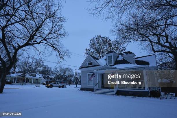 Utilities truck drives down the street during a power outage in McKinney, Texas, U.S., on Tuesday, Feb. 16, 2021. The energy crisis crippling the...