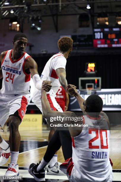 Jalen Smith of the Agua Caliente Clippers is helped up by his teammates during the game against the Raptors 905 on February 17, 2021 at HP Field...