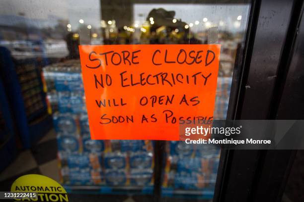 Sign states that a Fiesta Mart is closed because of a power outage in Austin, Texas on February 17, 2021. Millions of Texans are still without water...