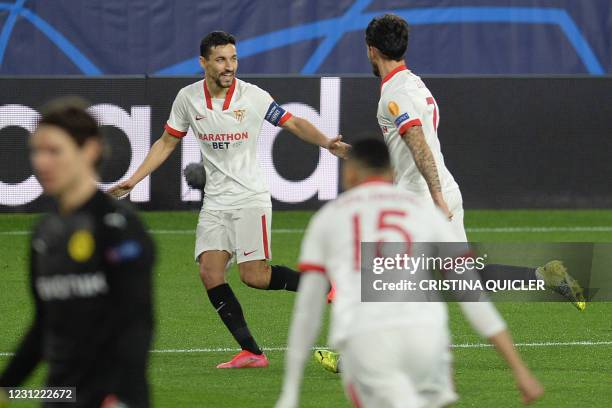 Sevilla's Spanish midfielder Suso celebrates with Sevilla's Spanish midfielder Jesus Navas after scoring a goal during the UEFA Champions League...