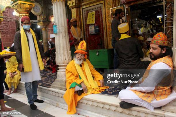 Devouts throng the Nizamuddin Dargah embraced in yellow on the occasion of 'Sufi Basant' on February 16, 2021 in New Delhi, India. The Hindu spring...