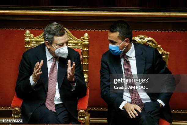 Italian Prime Minister Mario Draghi and Italian Foreign Minister Luigi Di Maio attend the debate ahead of the confidence vote on the new Italian...