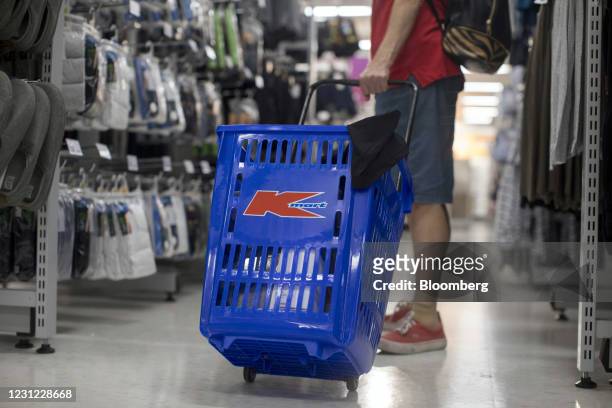 Customer pulls a shopping cart at a KMart store, operated by Wesfarmers Ltd., in Sydney, Australia, on Thursday, Feb. 18, 2021. Wesfarmers is...