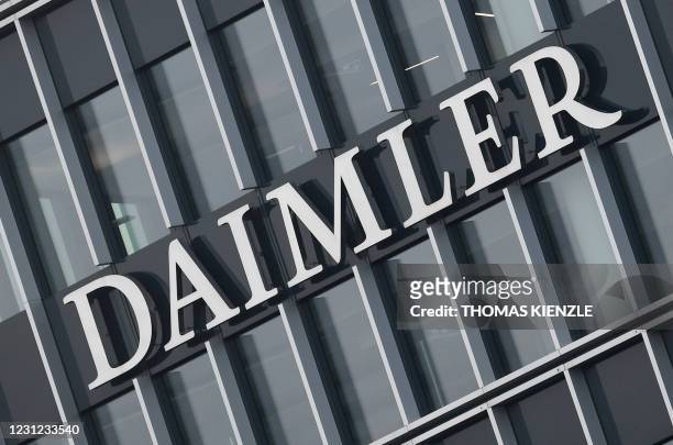 The logo of German concern Daimler AG is seen at the company's headquarters in Stuttgart, southern Germany, on February 18 as Daimler holds the...