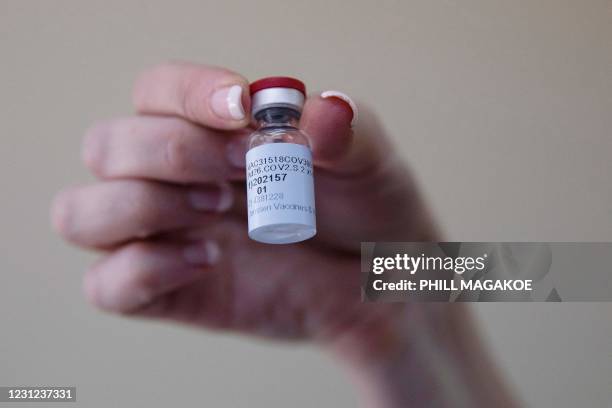 Healthcare worker holds a dose of the Johnson & Johnson vaccine against the COVID-19 coronavirus as South Africa proceeds with its inoculation...