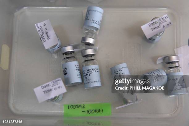 Empty vials that contained a dose of the Johnson & Johnson vaccine against the COVID-19 coronavirus lie on a table as South Africa proceeds with its...