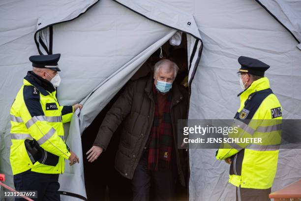 German Interior Minister Horst Seehofer leaves a tent during his visit of Germany's Federal Police that carries out controls at the German-Czech...