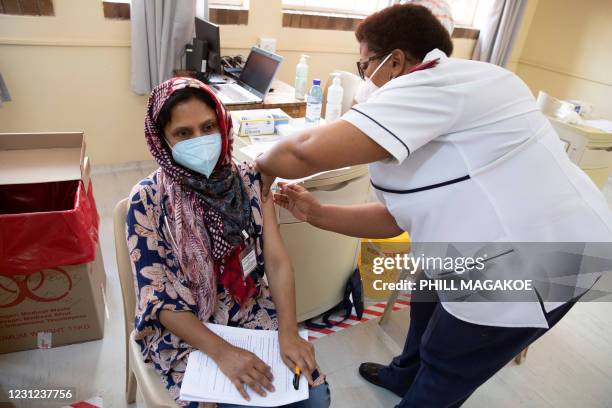 Healthcare worker receives a dose of the Johnson & Johnson vaccine against the COVID-19 coronavirus as South Africa proceeds with its inoculation...