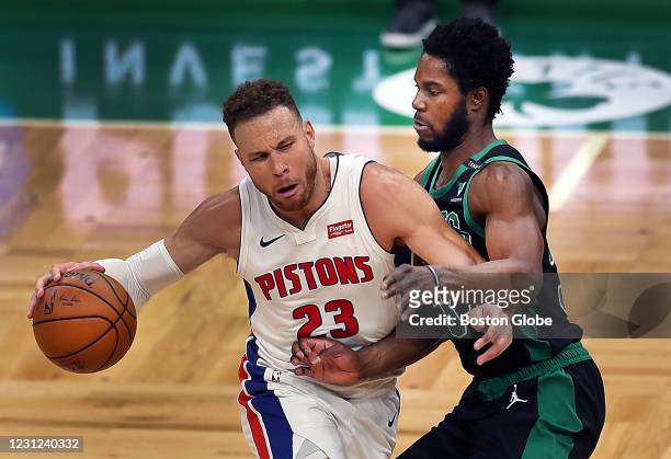 Boston Celtics' Semi Ojeleye guards Detroit Piston's Blake Griffin as he drives to the basket in the second quarter. The Boston Celtics host the...