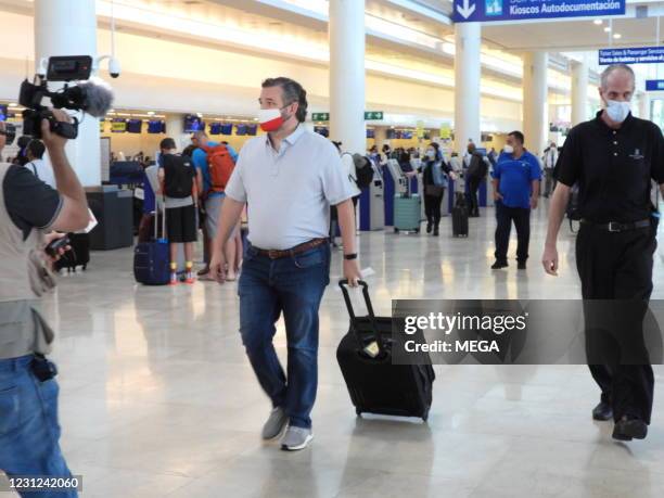 Sen. Ted Cruz checks in for a flight at Cancun International Airport after a backlash over his Mexican family vacation as his home state of Texas...