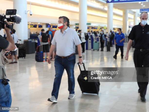 Sen. Ted Cruz checks in for a flight at Cancun International Airport after a backlash over his Mexican family vacation as his home state of Texas...