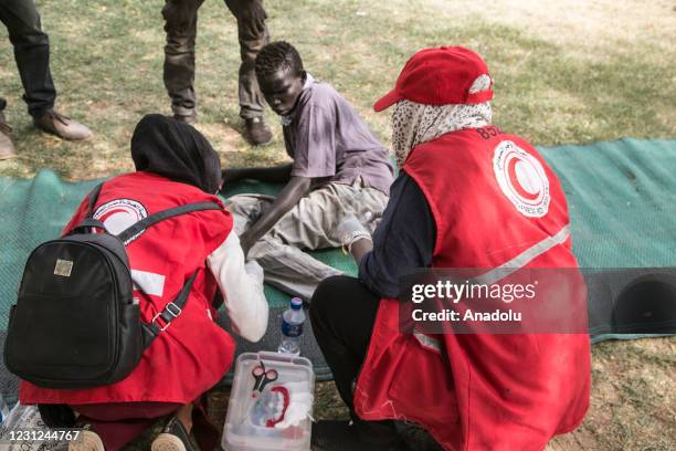 Members of Turkish Red Crescent distribue clothes to orphans in Khartoum, Sudan on February 18, 2021.