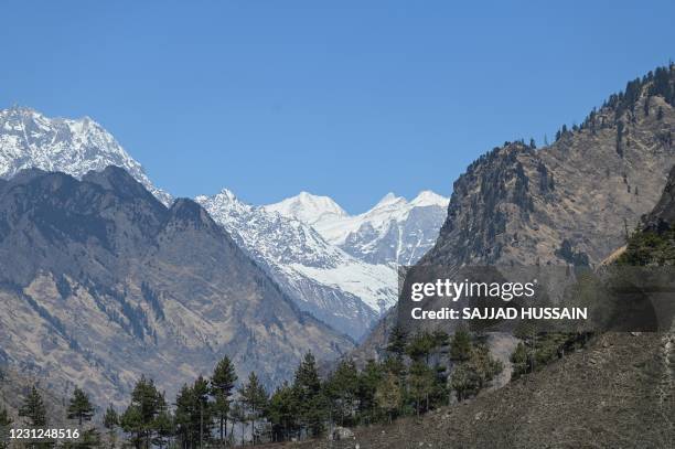 In this picture taken on February 11, 2021 a snowcapped Himalayan mountains peak is seen in Uttarakhand's Chamoli district. - Long before this...