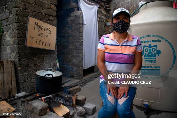 Leticia, a member of the collective Mujeres de la Tierra, speaks during an interview, in Milpa Alta, Mexico City, on February 16, 2021. - The...