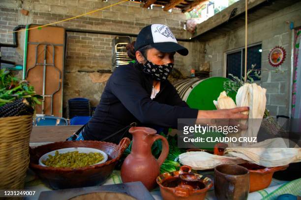 Leticia, a member of the collective Mujeres de la Tierra, prepares Tamales -a Mexican traditional dish-, in Milpa Alta, Mexico City, on February 16,...