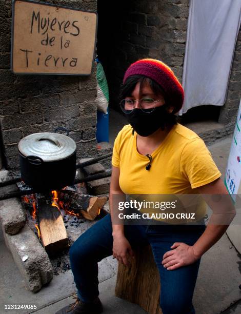 Chio, a member of the collective Mujeres de la Tierra, speaks during an interview, in Milpa Alta, Mexico City, on February 16, 2021. - The collective...