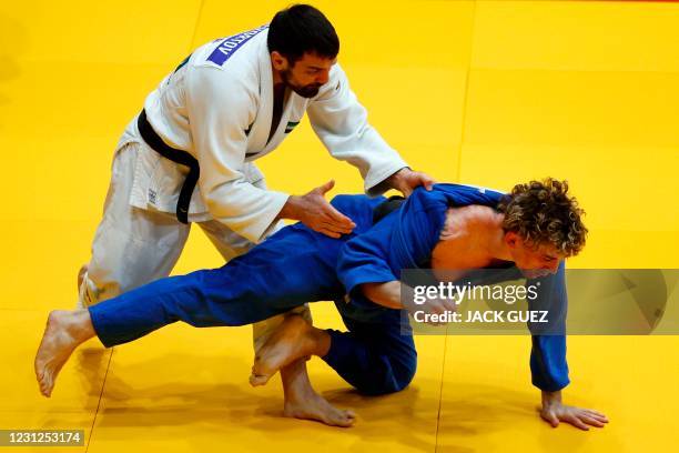 S judoka Victor Scvortov competes against Italy's judoka Giovanni Esposito in the men's under 73kg category of Tel Aviv Grand Slam 2021 in the...