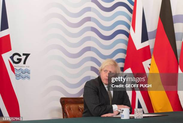 Britain's Prime Minister Boris Johnson hosts a virtual meeting of G7 leaders in the Cabinet Room at Downing Street in London on February 19, 2021. -...