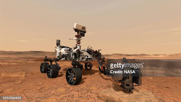 In this concept illustration provided by NASA, NASA's Perseverance rover uses its drill to core a rock sample and will store them in sealed tubes on...