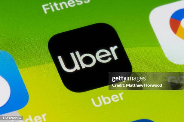 In this photo illustration a close-up of an Uber app is seen on an iPhone on February 19, 2021 in Cardiff, Wales. Uber drivers in the UK have won a...