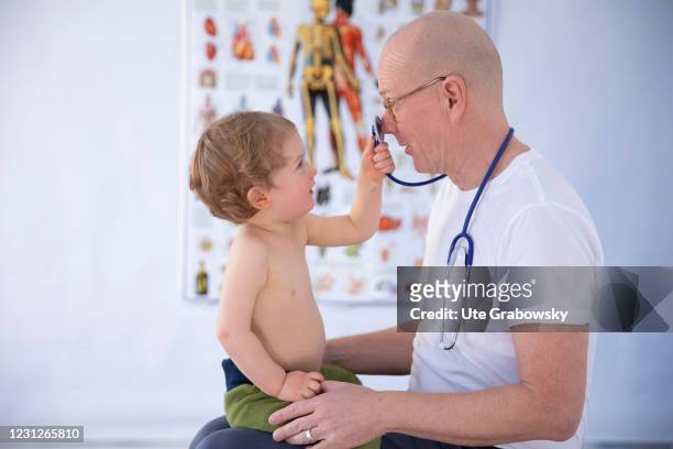 Bonn, Germany In this photo illustration pediatrician tries to listen to the heart of a patient on February 19, 2021 in Bonn, Germany.