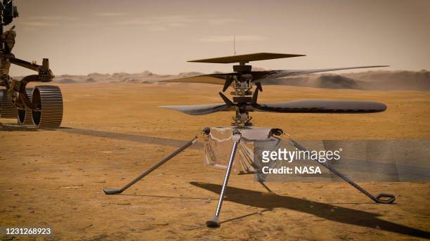 In this concept illustration provided by NASA, NASA's Ingenuity Mars Helicopter stands on the Red Planet's surface as NASA's Mars 2020 Perseverance...
