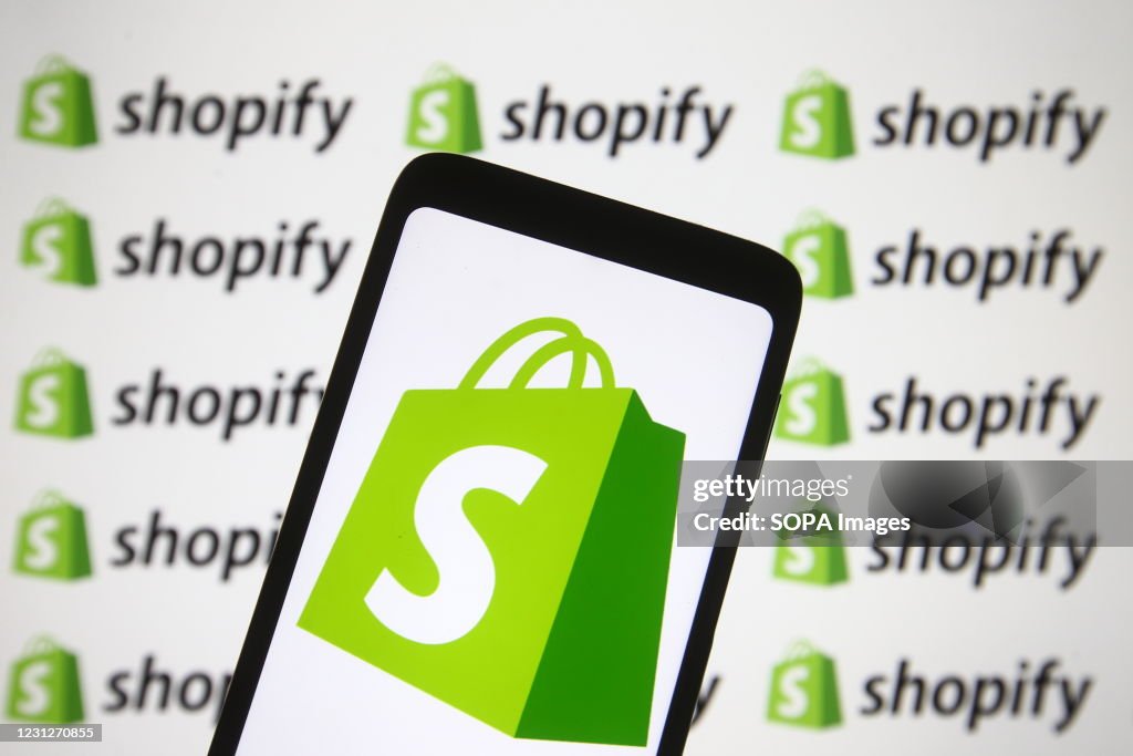 In this photo illustration a Shopify logo of a Canadian...