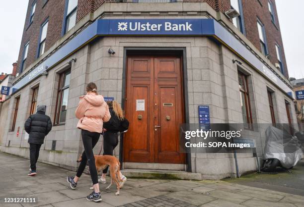 People walk past the Ulster Bank branch in Ranelagh, Dublin. Ulster Bank confirmed today a withdrawal from the Irish market. The bank, is to close...