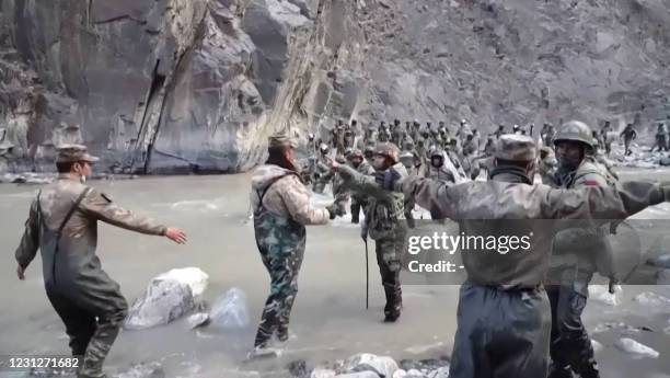 This video frame grab taken from footage recorded in mid-June 2020 and released by China Central Television on February 20, 2021 shows Chinese and...