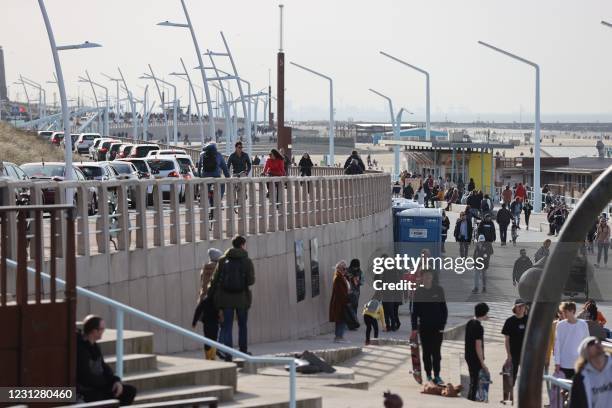 Pedestrians walk on the boulevard of Scheveningen in The Hague, on February 20, 2021. / Netherlands OUT